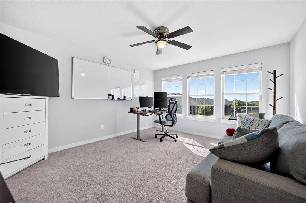 5534 Yarborough Drive, Forney, TX 75126 Recessed lighting, ceiling fan with integrated lighting, three large windows, and carpet flooring