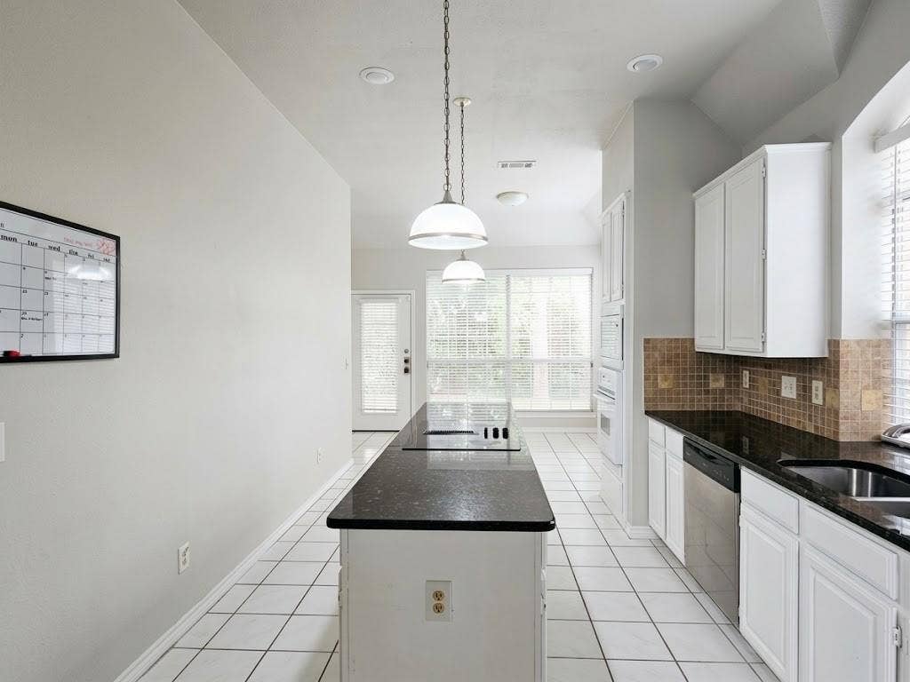 2609 Townshed Drive, Garland, TX 75044 Kitchen with white cabinetry, dark countertops, a tiled backsplash, and recessed lighting