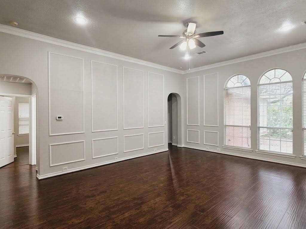 2609 Townshed Drive, Garland, TX 75044 Recessed lighting, crown molding, arched windows, wood-finish flooring, and a ceiling fan