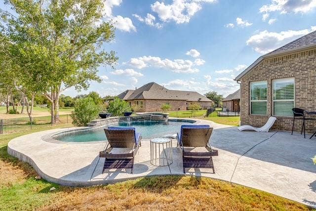 1314 Prestwick Court, Granbury, TX 76048 Salt water pool with spa, tanning ledge and fire bowls