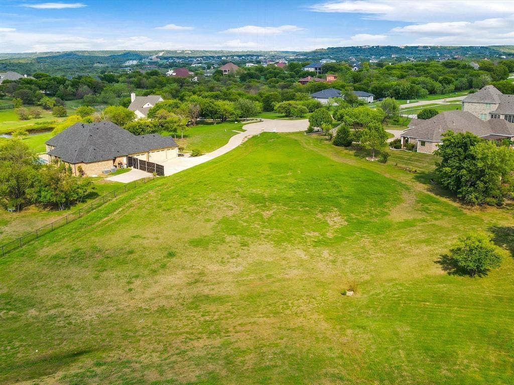 1036 Lighthouse Court, Grand Prairie, TX 75104 Expansive grassy lot with a gentle slope