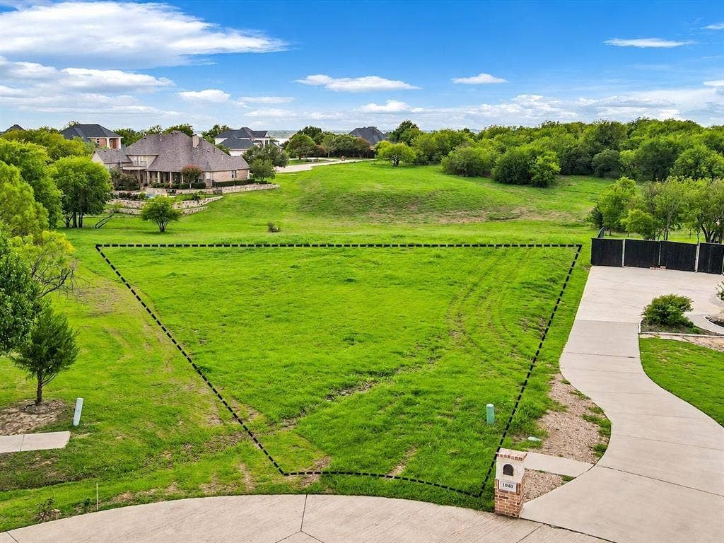1036 Lighthouse Court, Grand Prairie, TX 75104 Expansive undeveloped lot featuring a natural grass landscape