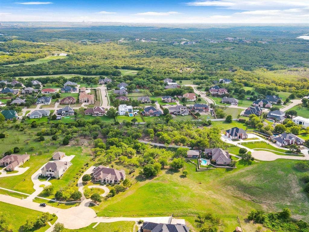 1036 Lighthouse Court, Grand Prairie, TX 75104 Expansive residential area featuring numerous single-family homes, mature trees, and lush green spaces