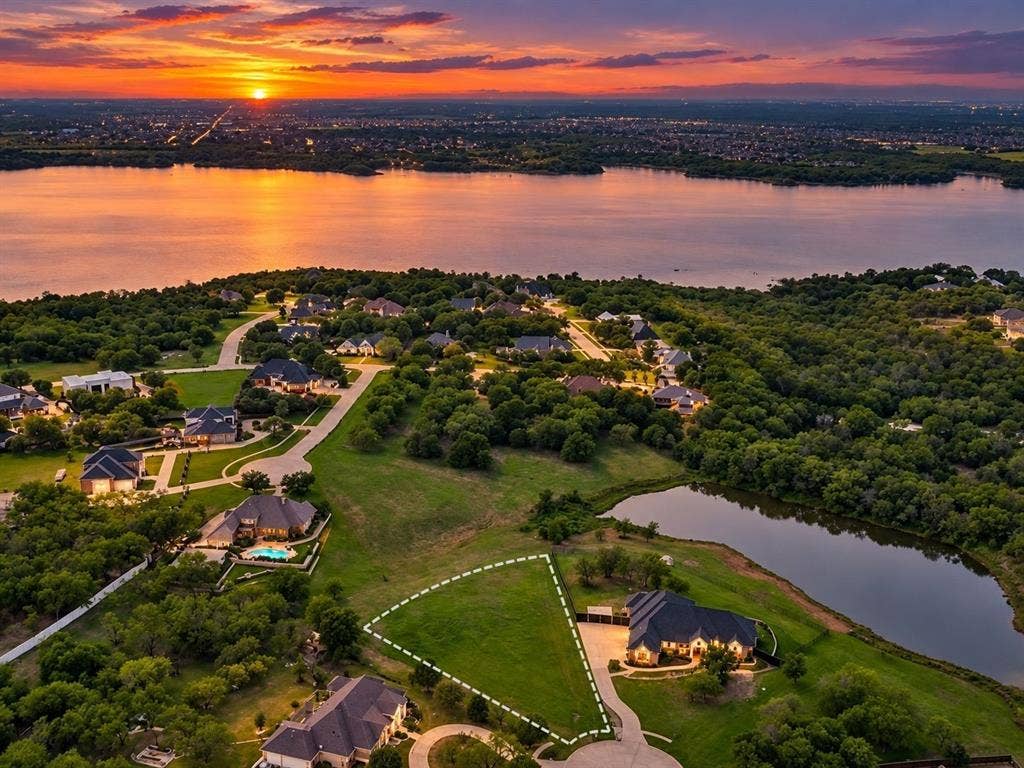 1036 Lighthouse Court, Grand Prairie, TX 75104 Expansive green lot featuring a water frontage, established residential surroundings, and direct road access