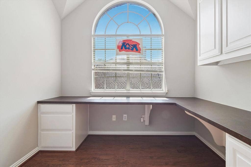 8323 Albritton Drive, Frisco, TX 75036 Built-in L-shaped desk with dark-toned surface and integrated drawers