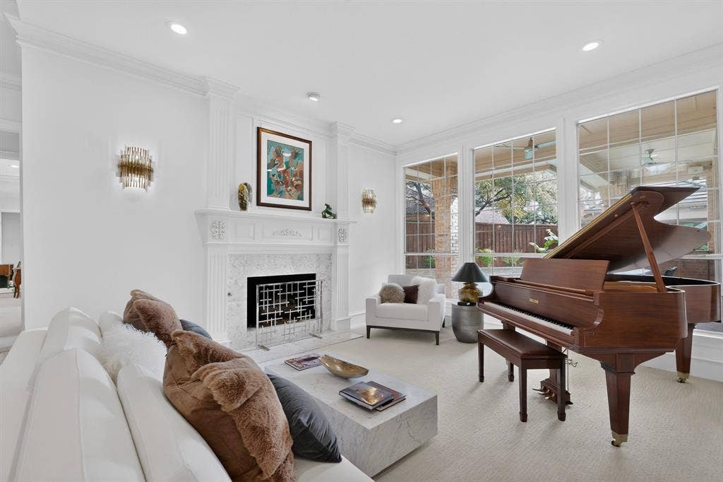 4536 Briar Oaks Circle, Dallas, TX 75287 Living area featuring a detailed fireplace with a marble surround, large windows, and recessed lighting
