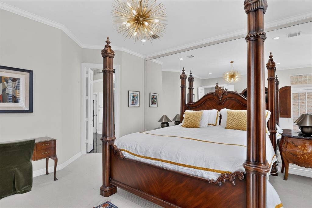 4536 Briar Oaks Circle, Dallas, TX 75287 Crown molding, recessed lighting, and a unique sputnik-style chandelier