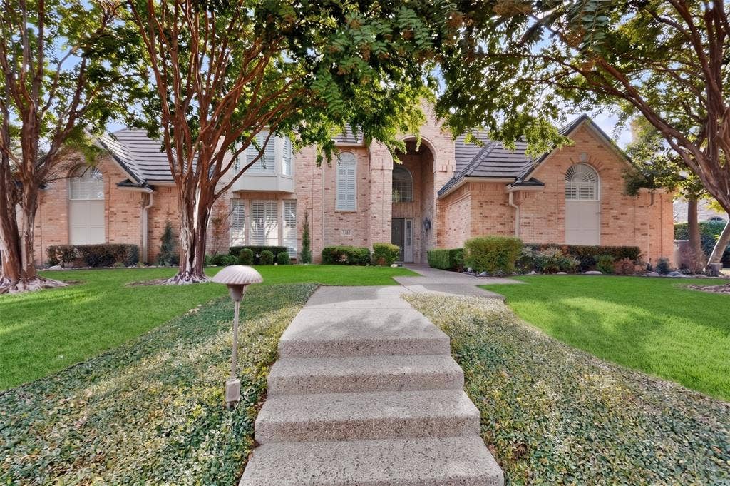 4536 Briar Oaks Circle, Dallas, TX 75287 Brick exterior with a tiled roof