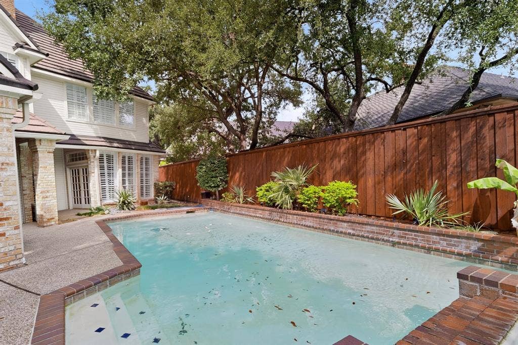 4536 Briar Oaks Circle, Dallas, TX 75287 Private swimming pool with brick coping and integrated steps