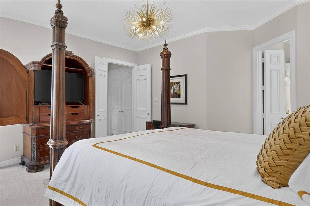 4536 Briar Oaks Circle, Dallas, TX 75287 Recessed lighting, crown molding, and built-in wood cabinetry with storage