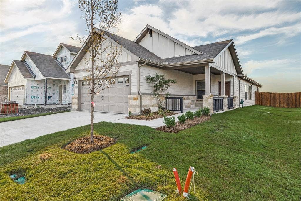 1006 Angel Street, Josephine, TX 75173 Brand-New Bungalow-Style Home! - Built by Meritage Homes, this charming single-story home features distinctive gabled rooflines, attractive stone accents, a welcoming covered front porch, and fresh landscaping in Josephine's newly opened Morgan Farms community.