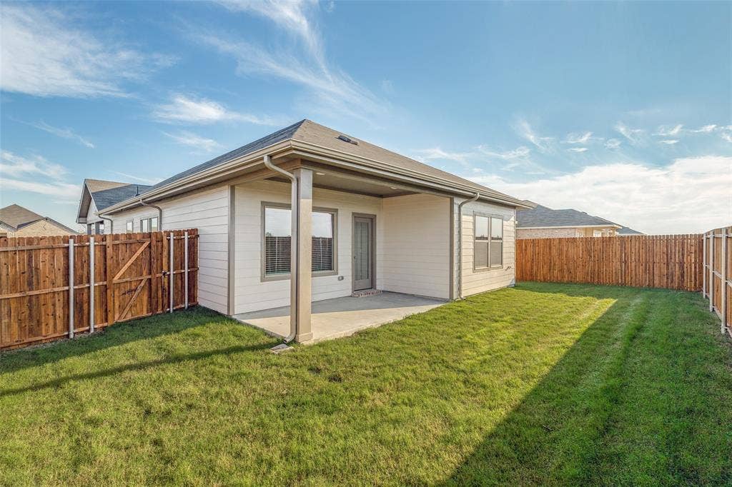 1006 Angel Street, Josephine, TX 75173 Fresh Sod, Privacy & Room to Enjoy the Outdoors! - The fully fenced backyard features fresh Bermuda sod, a six-foot board-on-board wood privacy fence, and a generous covered patio. There's plenty of room to relax, garden, entertain, or simply enjoy your own private outdoor space.