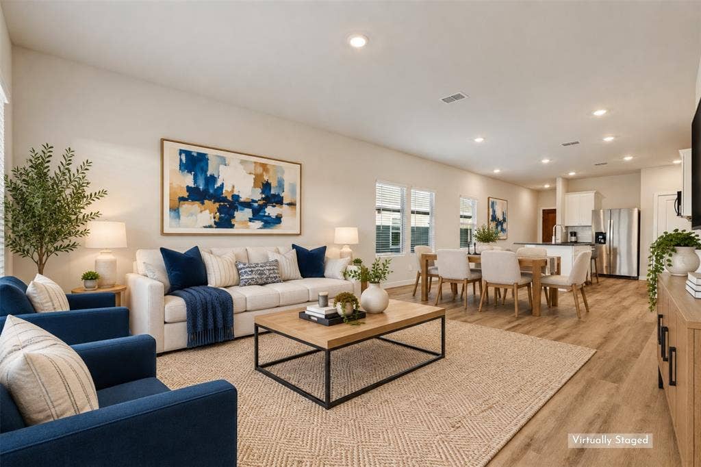 1006 Angel Street, Josephine, TX 75173 A Family Room That Feels Like Home! - Generous wall space, multiple windows, and a comfortable layout provide plenty of possibilities for relaxing, watching movies, or hosting friends. The seamless connection to the dining area and kitchen keeps everyone connected without sacrificing defined living spaces.