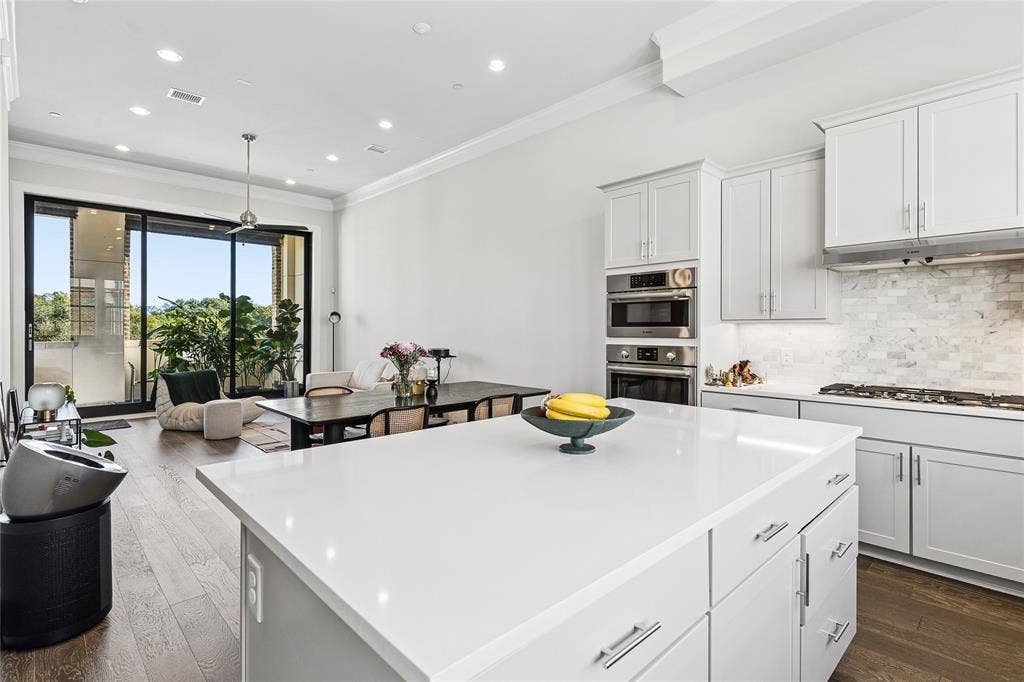 Kitchen opens to dining and living areas.