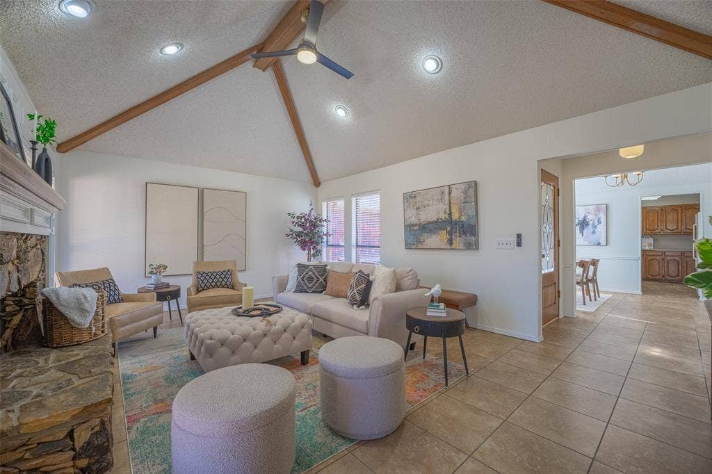 410 W Oak Street, Wylie, TX 75098 Vaulted ceiling with exposed wood beams, recessed lighting, and a ceiling fan