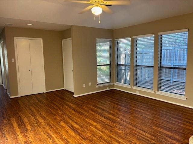 3028 Airhaven Street, Dallas, TX 75229 Wood-finish flooring throughout, multiple windows with blinds, ceiling fan with integrated lighting, and guest closet