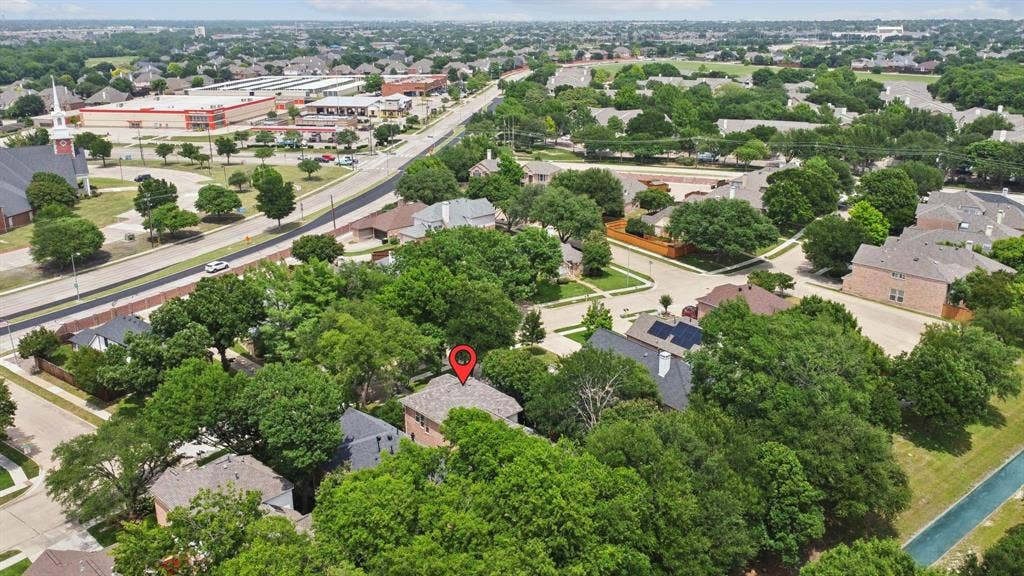 4816 Rockcreek Lane, Plano, TX 75024 Aerial rendering showcasing the surrounding neighborhood, featuring tree-lined streets and established residential properties