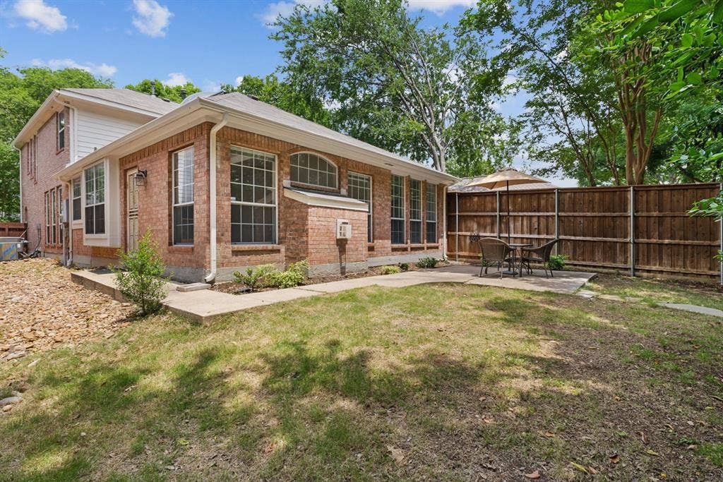 4816 Rockcreek Lane, Plano, TX 75024 Expansive brick exterior with multiple windows