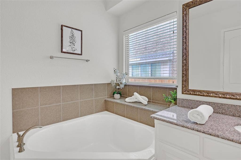 8730 Isaac Street, Plano, TX 75024 Bathroom with a bath and vanity