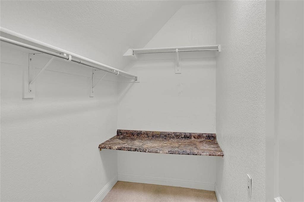 8730 Isaac Street, Plano, TX 75024 Spacious closet featuring lofted ceiling