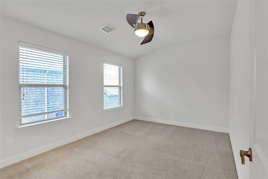 8730 Isaac Street, Plano, TX 75024 Spare room with a ceiling fan, healthy amount of natural light, carpet flooring, and vaulted ceiling