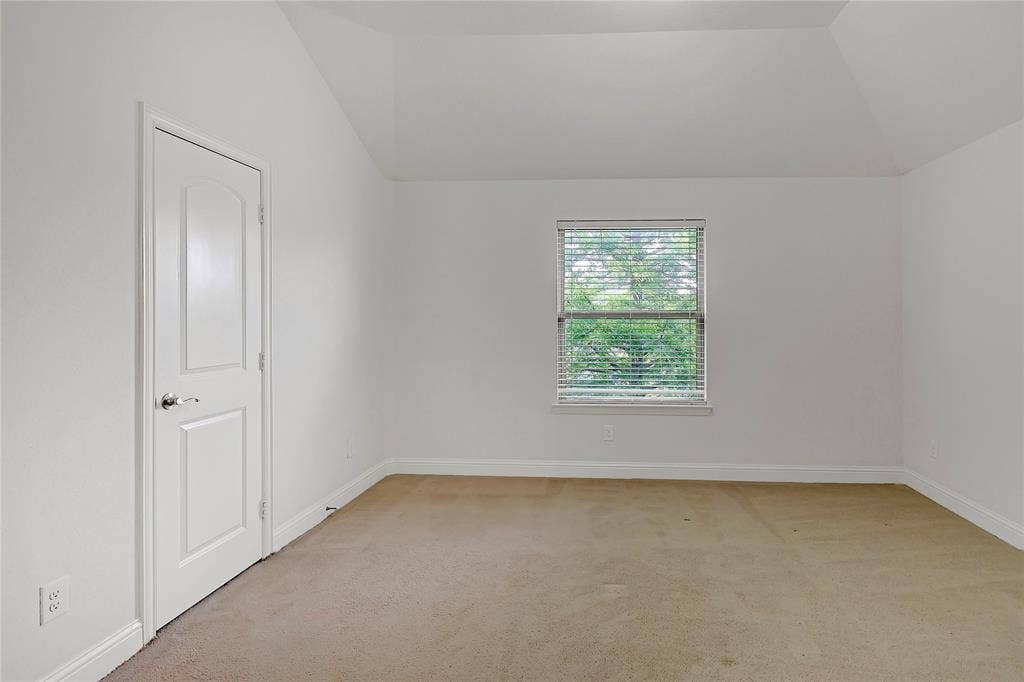 8730 Isaac Street, Plano, TX 75024 Carpeted spare room featuring lofted ceiling