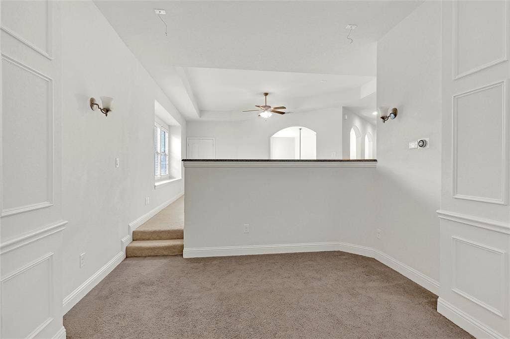 8730 Isaac Street, Plano, TX 75024 Spare room with light colored carpet and a ceiling fan