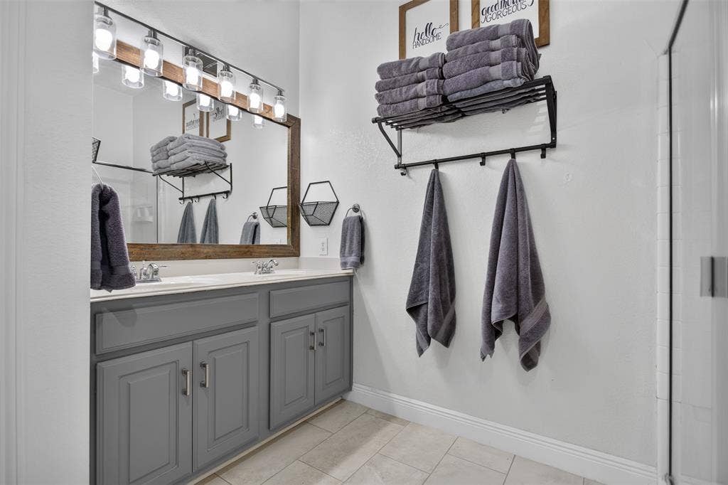 4001 Bridge Water Road, Heartland, TX 75126 Primary bath with dual sinks and stand up shower