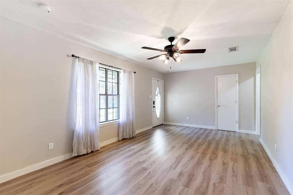 Living room flows effortlessly to dining room.