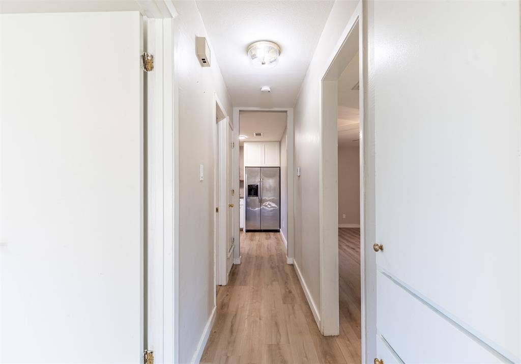 Hallway with linen storage.