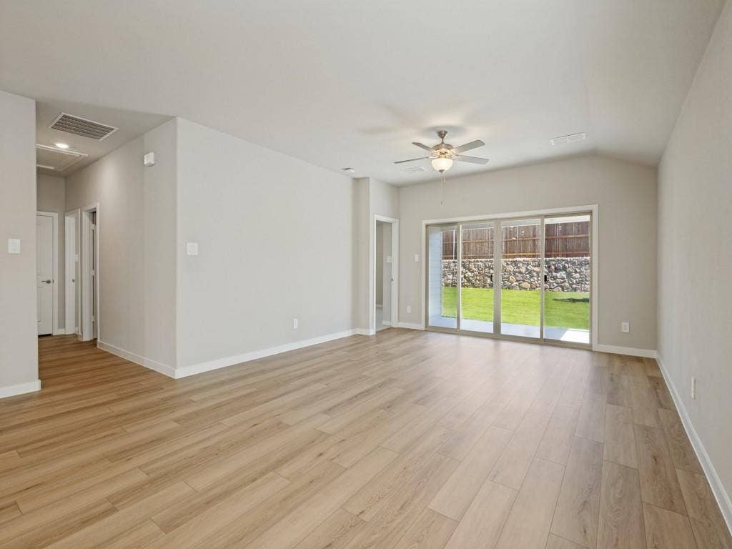 6207 Castamere Drive, Princeton, TX 75071 Living room with sliding doors that open to covered patio