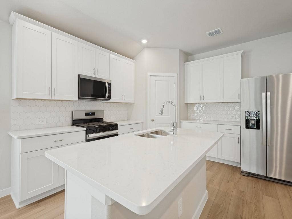 6207 Castamere Drive, Princeton, TX 75071 Kitchen with stainless steel appliances and a walk-in pantry