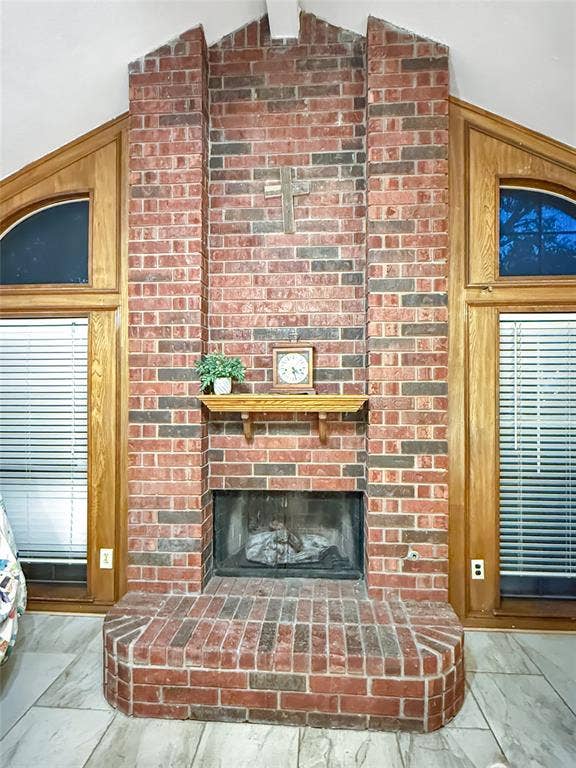 316 N Winding Oaks Drive, Wylie, TX 75098 Brick fireplace with a wood mantel, raised hearth, and integrated firebox