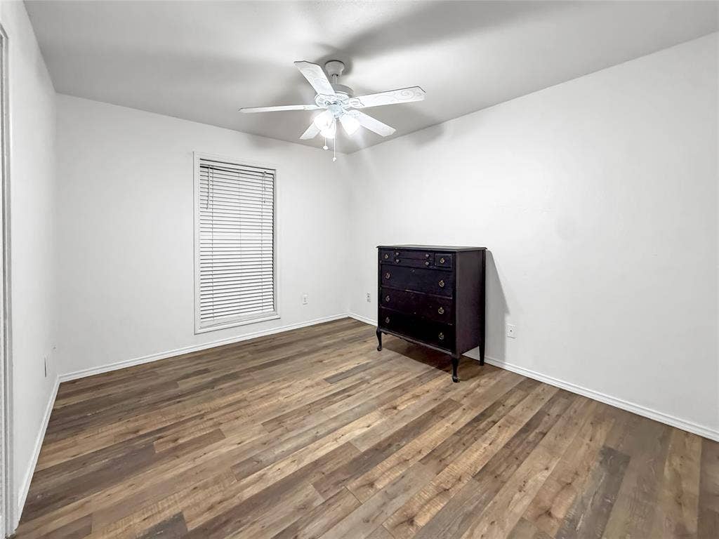 316 N Winding Oaks Drive, Wylie, TX 75098 Wood-finish flooring with crisp white walls and ceiling