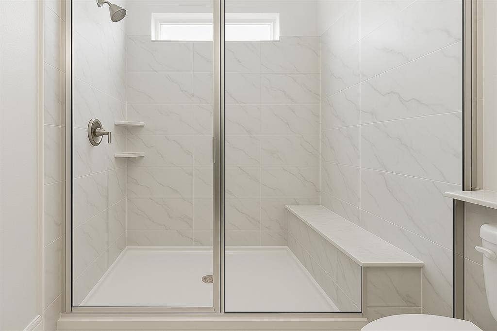 1733 Dalhart Road, Plano, TX 75075 Walk-in shower with clear glass enclosure, built-in bench, two corner shelves, and a transom window