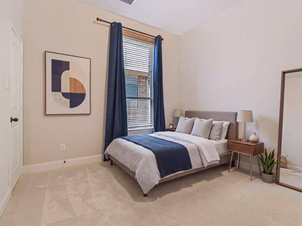Plush carpet flooring, neutral painted walls, window with blinds, recessed lighting, and a solid-core door
