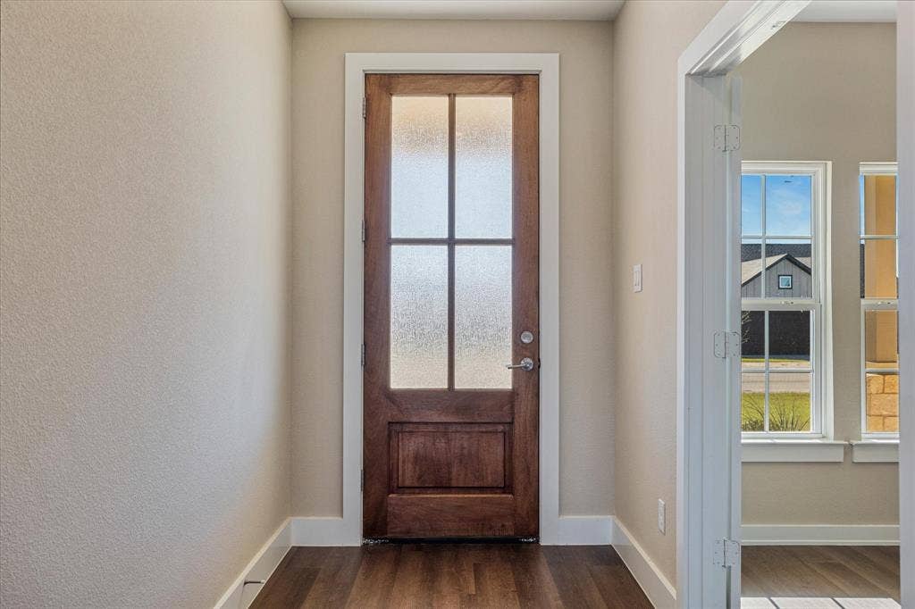 Rich wood-finish flooring with crisp white trim