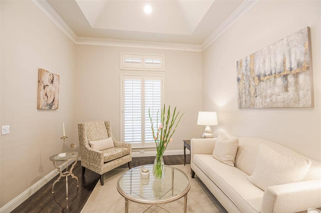 5925 Westmont Drive, Plano, TX 75093 Tray ceiling with crown molding, plantation shutters, wood-finish flooring, and recessed lighting