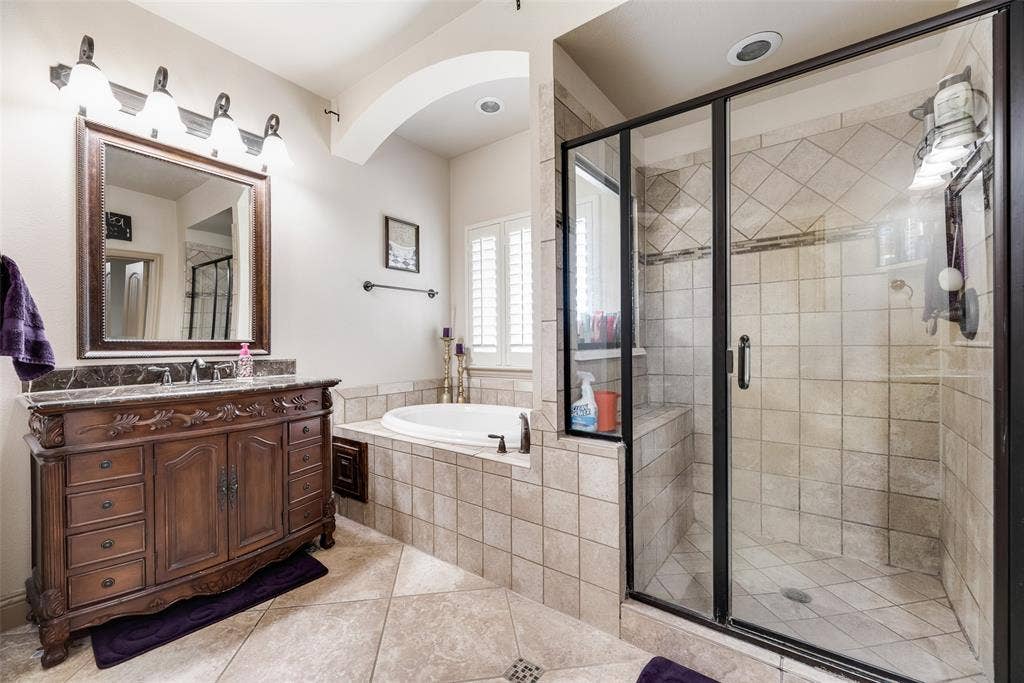 5056 Empire Way, Irving, TX 75038 Primary Bathroom #3 featuring tile patterned walk in shower