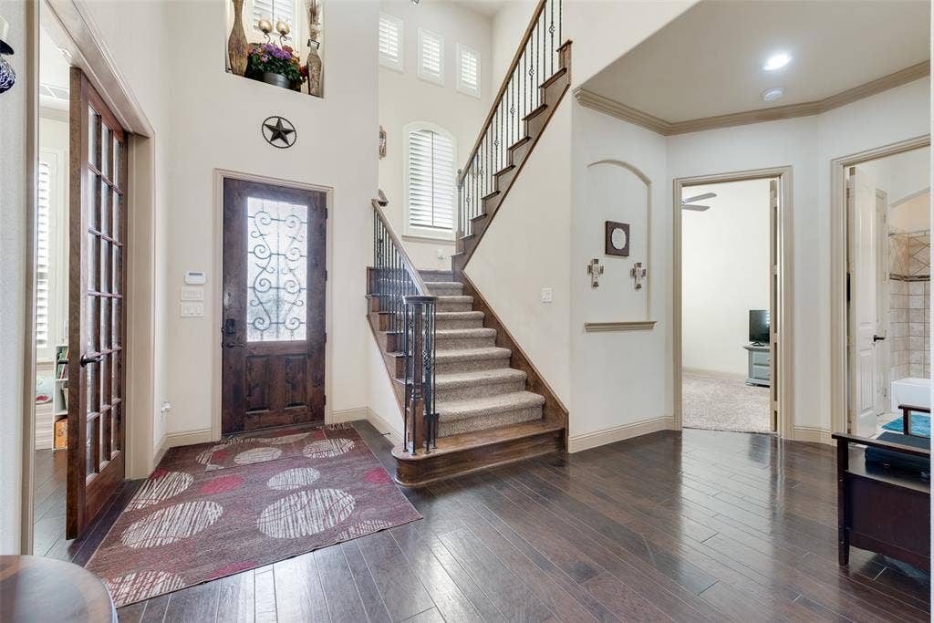 5056 Empire Way, Irving, TX 75038 Inviting Foyer with ornamental molding, dark wood-type flooring, and a wealth of natural light