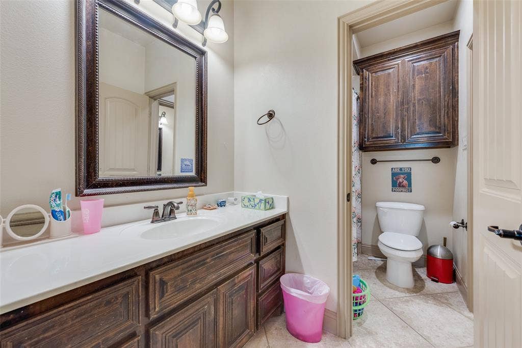 5056 Empire Way, Irving, TX 75038 Bathroom # 5 Jack and Jill Bathroom with vanity, toilet, and tile patterned flooring