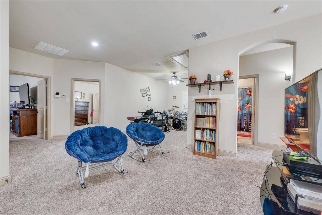5056 Empire Way, Irving, TX 75038 Rec room featuring light carpet and ceiling fan