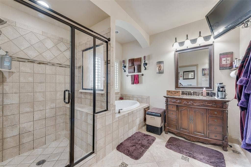 5056 Empire Way, Irving, TX 75038 Main Primary Bathroom featuring vanity, shower with separate bathtub, and tile patterned flooring