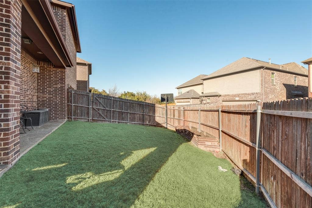 5056 Empire Way, Irving, TX 75038 Backyard with a sprinkler system