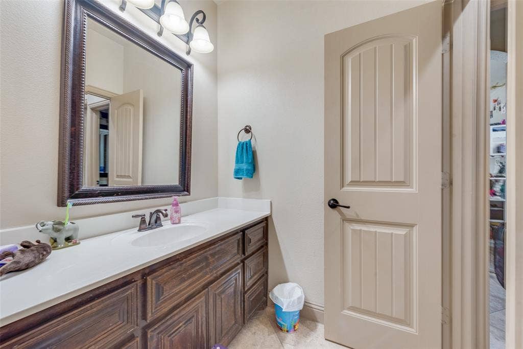 5056 Empire Way, Irving, TX 75038 Bathroom #5 Jack and Jill Bathroom with vanity and tile patterned floors