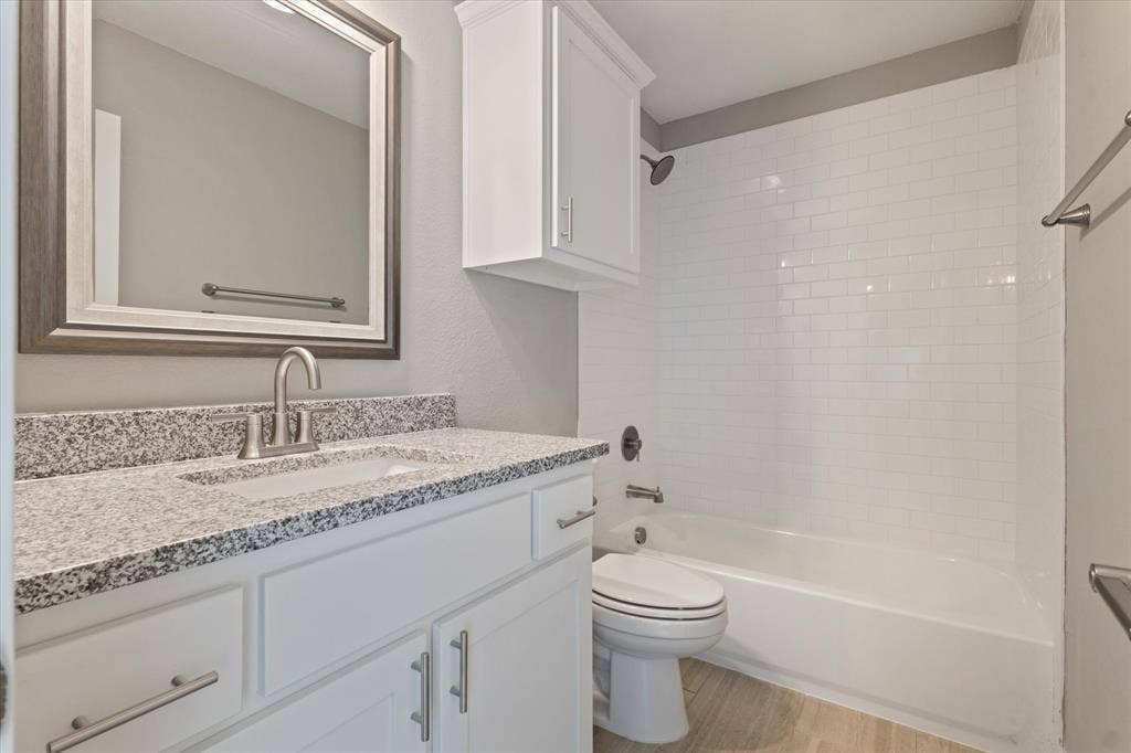 White subway tile shower surround with a built-in tub