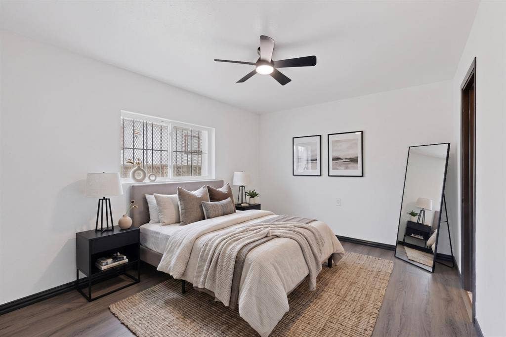 301 Stoneport Drive, Dallas, TX 75217 Bright white walls complement wood-finish flooring