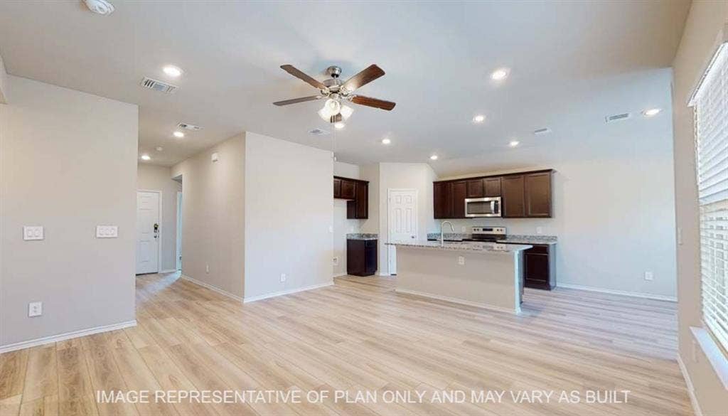 10412 Altair Drive, Waco, TX 76708 Open-concept living area featuring wood-finish flooring, recessed lighting, and a ceiling fan