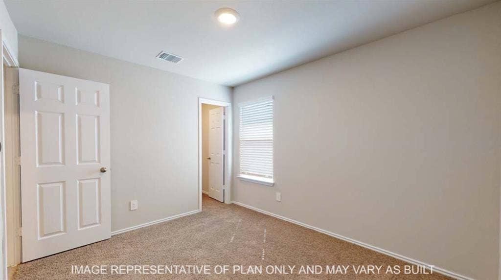 10412 Altair Drive, Waco, TX 76708 Neutral wall paint, plush carpeting, ceiling-mounted lighting, and window blinds