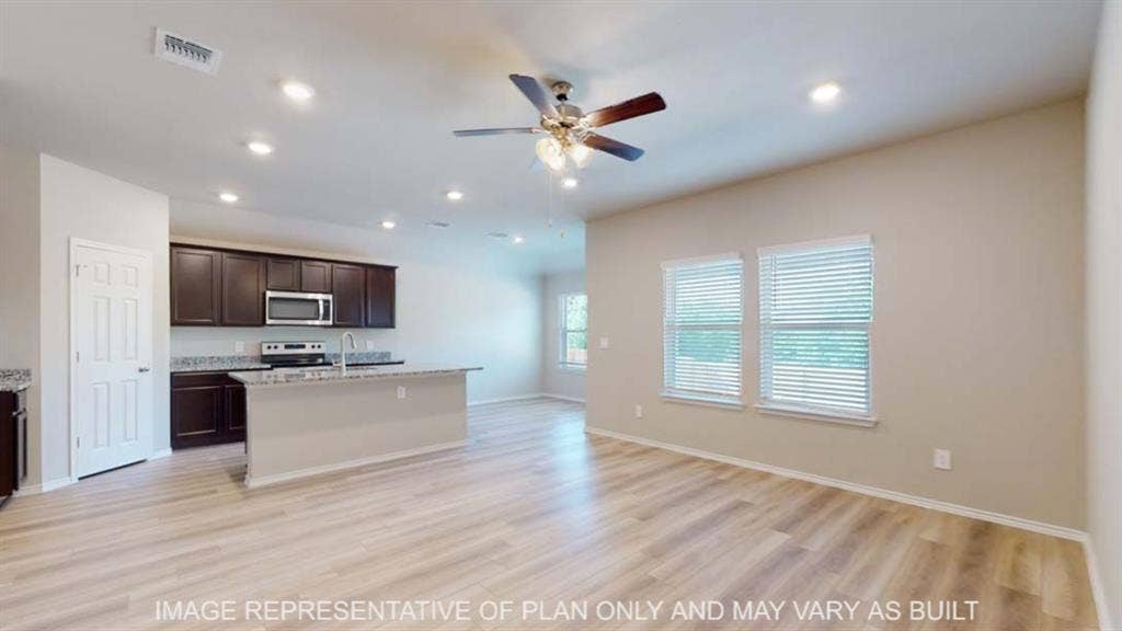 10412 Altair Drive, Waco, TX 76708 Open-concept living space featuring wood-finish flooring, recessed lighting, and a ceiling fan